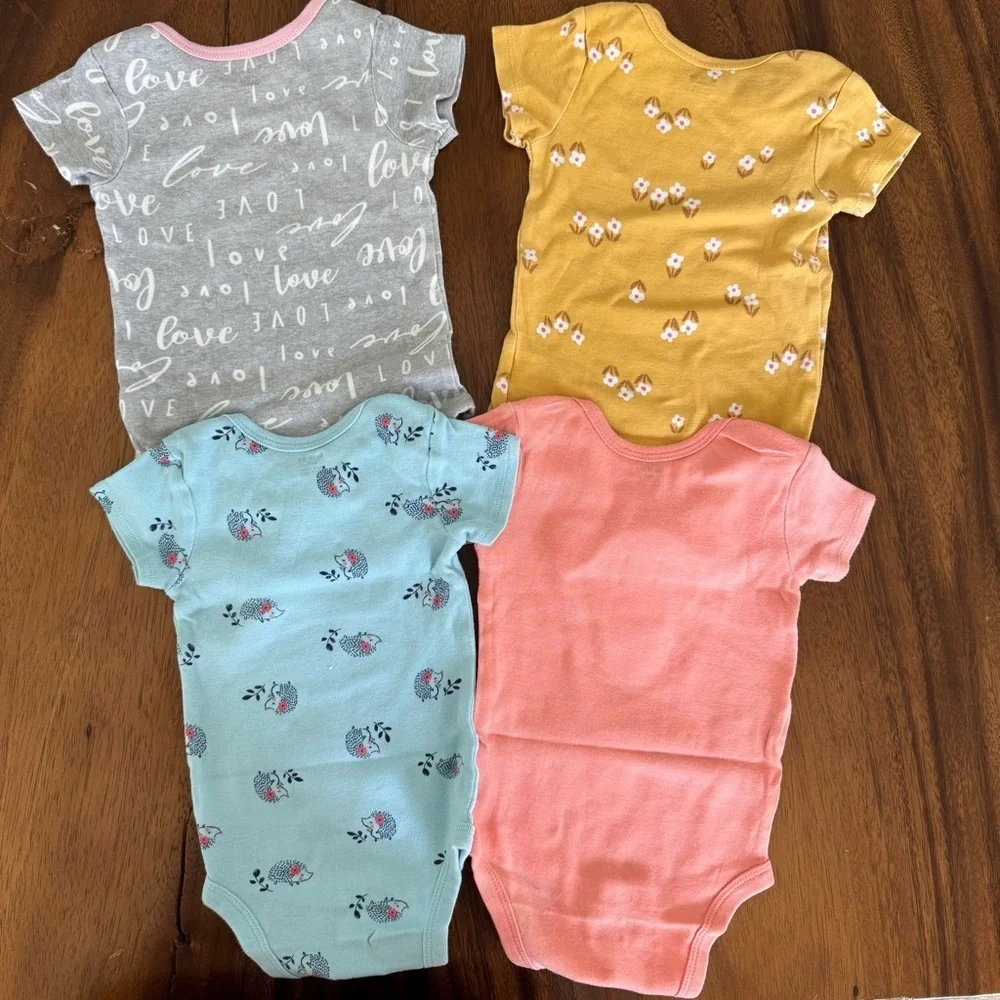 Gerber Set of Four Baby Onesies in Gray, Yellow, Blue, and PinkSize 6-9M
